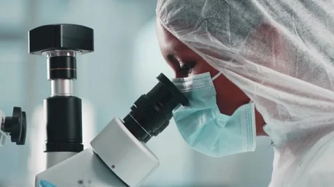 A magnified view of a bird flu virus, studied in a laboratory by experts. Stock Footage 336583595