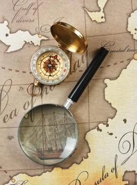 Magnifier and compass on  map Foto stock