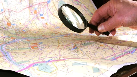 Magnifier being used to view a map. Stock Footage 70985136