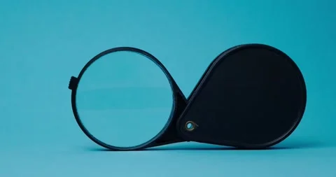 Magnifier on a blue background Stock Footage 140235573