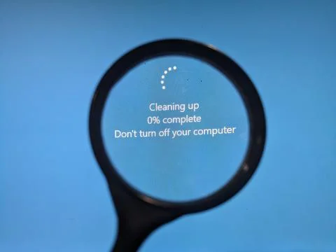 Magnifier on the blue screen of. the computer screen Stock Photos