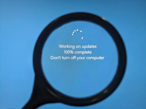 Magnifier on the blue screen of. the computer screen Stock Photos