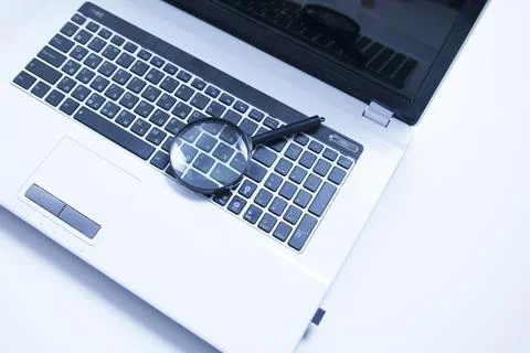 Magnifier On Computer Keyboard Stock Photos