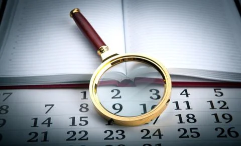 Magnifier on the diary Stock Photos