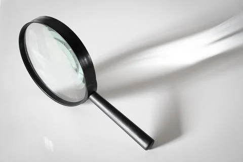 Magnifier with a handle Stock Photos