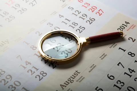 Magnifier lying on the calendar Foto stock