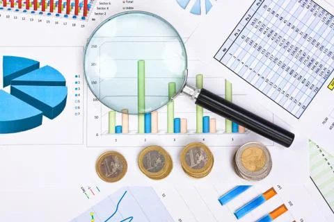 Magnifying glass and the working pape Stock-Fotos