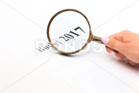Magnifying glass on Budget 2017 text paper Stock Photos