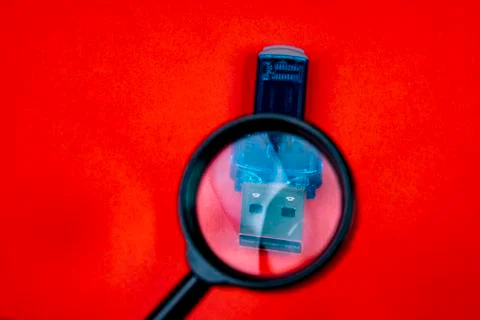 Magnifying glass data stick - data security and verification Stock Photos