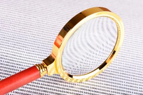 .magnifying glass on the digital code Stock Photos