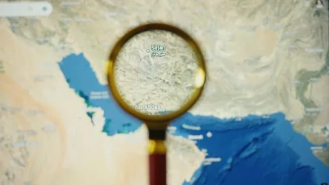 Magnifying glass exploring iran and uae map Stock Footage 339806496