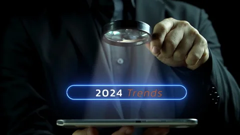 Magnifying glass focus on browsing tool bar with the text 2024 trends Stock Footage 258019064