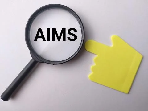 A magnifying glass frames the word AIMS beside a yellow hand-shaped pointin.. Stock Photos