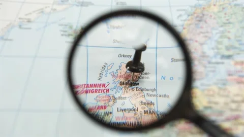 Magnifying glass highlights location on map of Glasgow Stock Footage 340482594