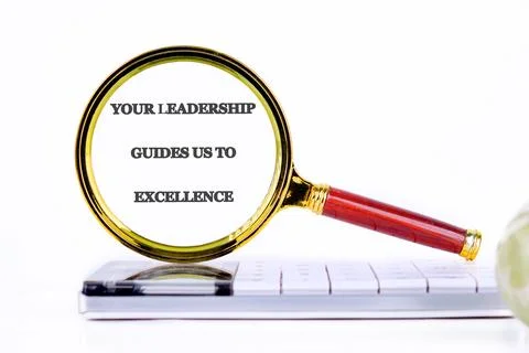 A magnifying glass highlights the text emphasizing leadership's role in achie Stock Photos