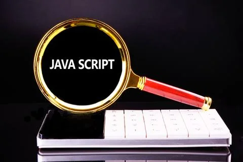 A magnifying glass magnifies the word JavaScript against a glossy keyboard su 写真素材