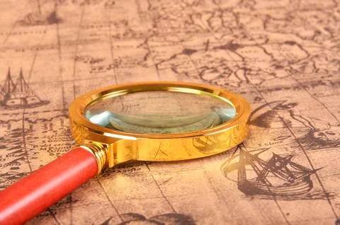Magnifying glass on the map Stock Photos