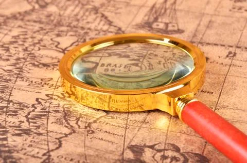 Magnifying glass on the map Stock Photos