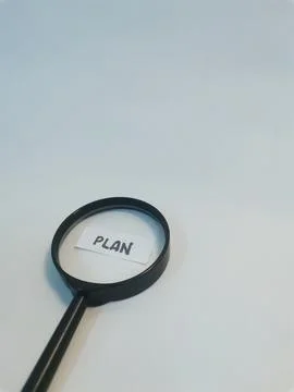 Magnifying Glass Over Plan Note Symbolizing Planning, Strategy, and Focus Stock Photos