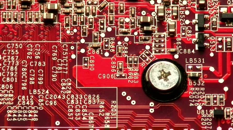 Magnifying glass passes across computer circuit board Stock Footage