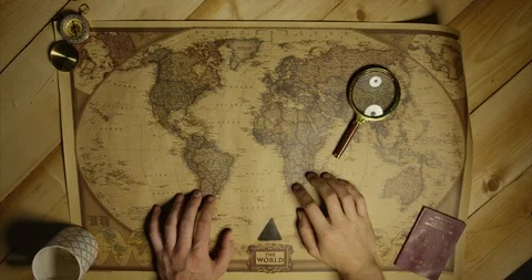 Magnifying Glass Put Up To Camera Then On Map Of World From Birdseye View Stock Footage 114033105