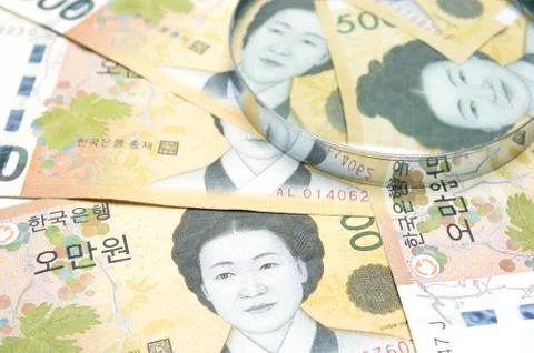 Magnifying Glass on South Korean won currency Stock Photos
