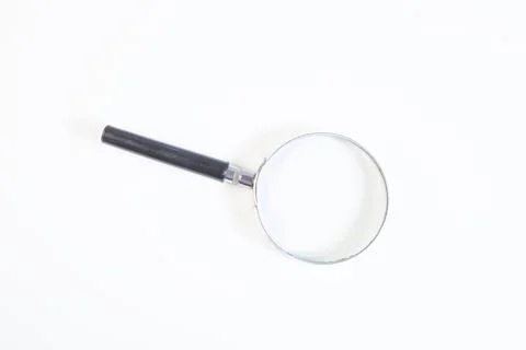 Magnifying glass on white background. Stock Photos
