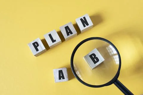 Magnifying zoom on Plan B against yellow background Stock Photos