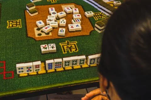 Mahjong Game in Progress from Player Over the Shoulder View Stock Photos