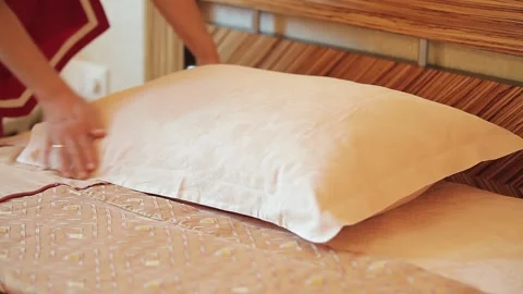 The maid adjusts the pillow Stock Footage 159222961
