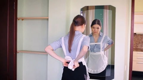 The maid cleans the mirror Stock Footage 83299492