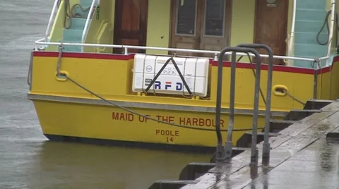 Maid of the harbour in the rain Stock Footage 7138986