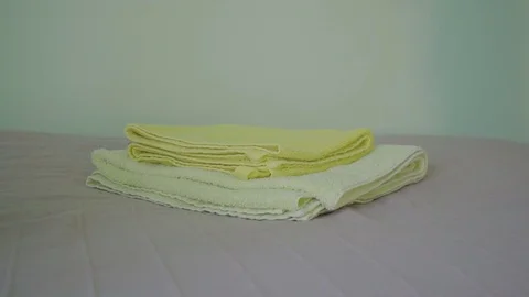 Maid makes bed in hostel close up 스톡 동영상 76628664
