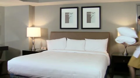 Maid makes bed V2 - HD Stock Footage 987497