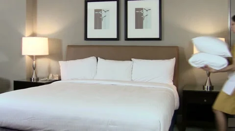 Maid makes bed V3 - HD Stock Footage 987486