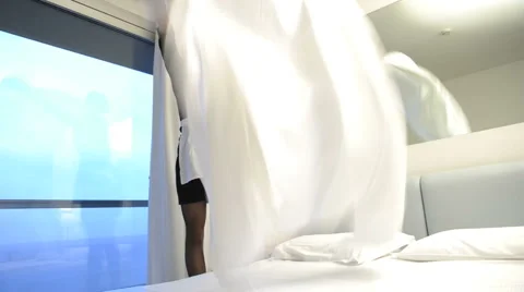 Maid making bed Stock Footage 1042822