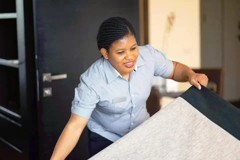 Maid Making Bed Stock Photos