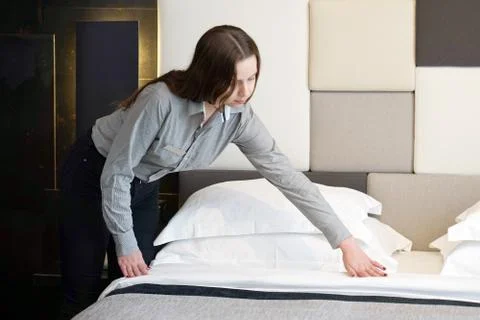 Maid Making Bed Stock Photos