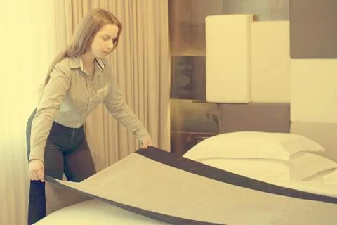 Maid Making Bed Stock Photos