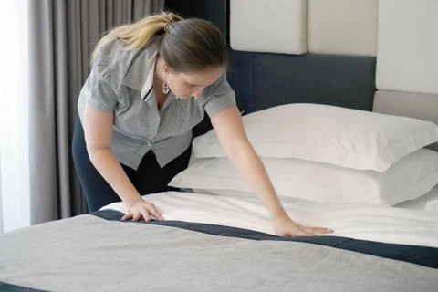 Maid Making Bed Stock Photos