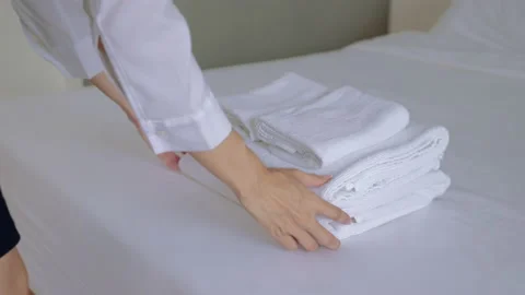 Premium Photo  Maid with fresh clean towels during housekeeping