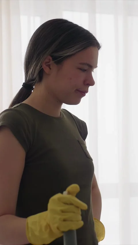 Maid Service Professional Cleaner with Mop and Yellow Gloves in Domestic Setting Stock Footage 346785685