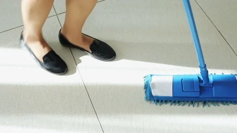 The maid washing the floor. Stockbeeldmateriaal 82070836