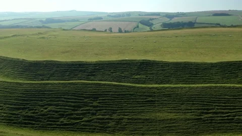 Maiden Castle MASSIVE Iron-Age Hill-Fort, Dorset UK, Drone Circling Ramparts 4K Stock Footage 219420845