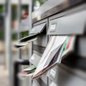Mail box full of junk mails Stock Photos