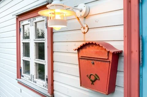 Mail box, window and lamp on a white wooden house Stock Photos