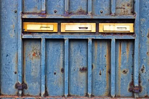 Mail boxes on rusty door Foto stock
