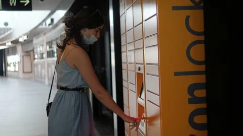 Mail delivery and post service concept - happy woman in medical mask taking Stock Footage 133066917