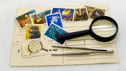 Mail envelope postage stamp and magnifying glass Stock Photos