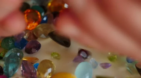 Mail hand pour out precious gemstones 4k Stock Footage 45480620
